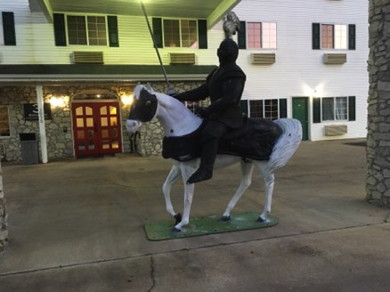 Tacky fiberglass Knight and Horse welcome us to the hotel