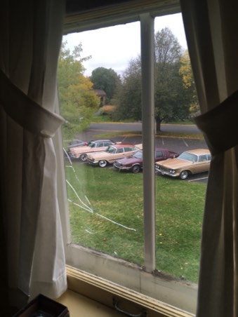Our cars in the lot from an upstairs window