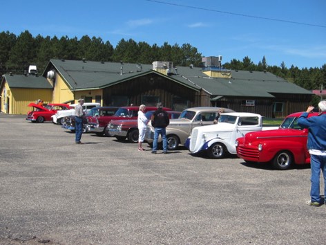 KJ's surrounded by Mystery Run cars