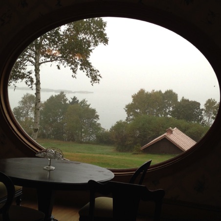 Unique oval window in dining room